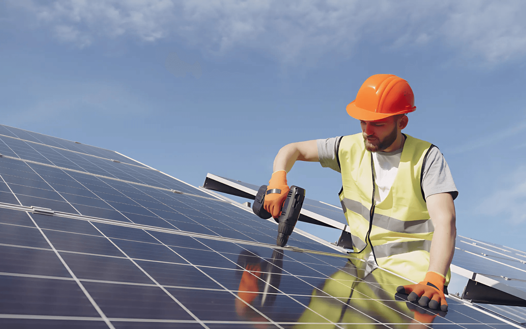 Worker installing solar panel